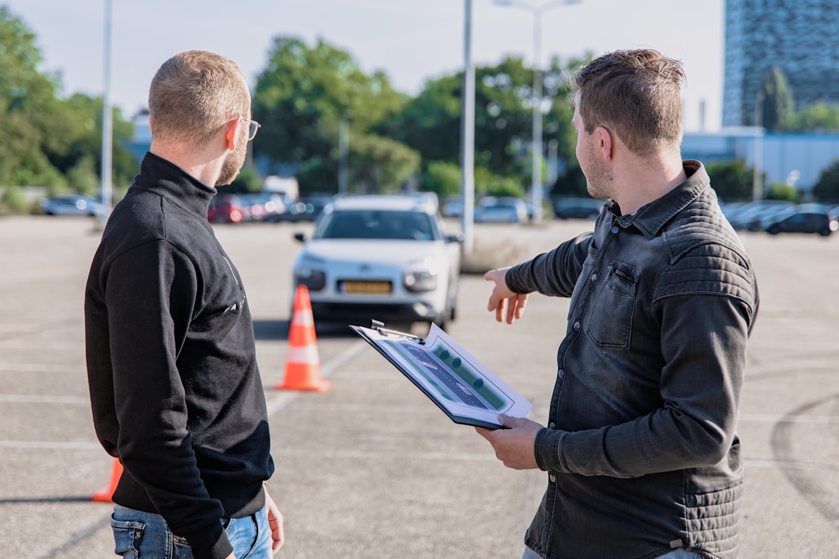 Driving instructor reviewing a test route with a student